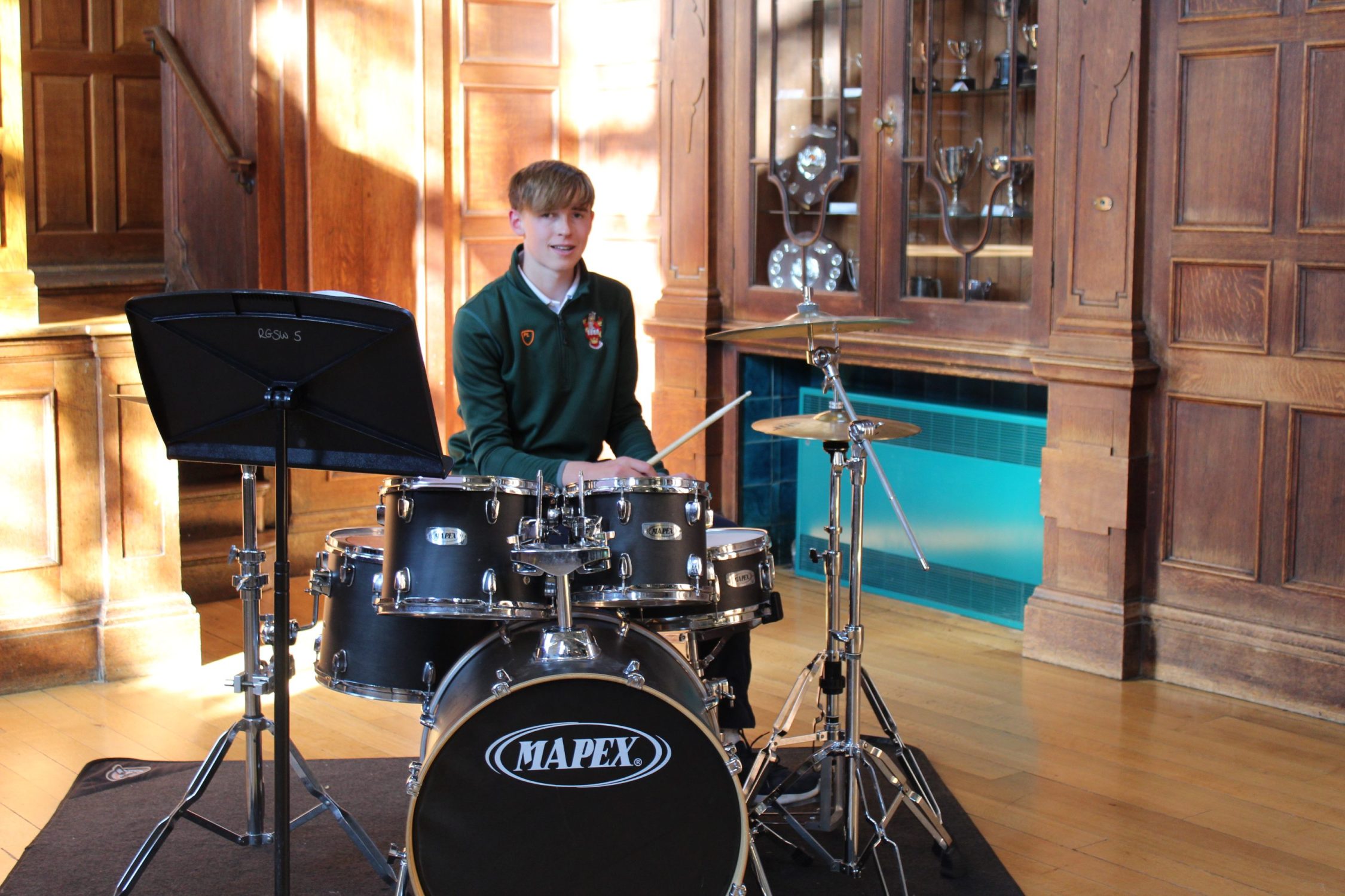 pupil playing drums