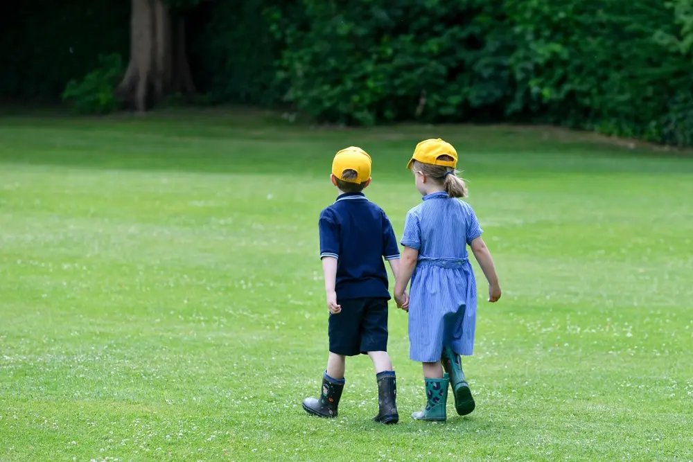 Springfield Nursery, two children in wellies walking